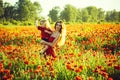 Woman and little boy or child in field of poppy Royalty Free Stock Photo