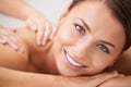 Woman, happy portrait and back massage at spa for beauty, skincare and healing at cosmetics salon. Face, client and Royalty Free Stock Photo