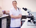 Woman, happy and scientist in laboratory with portrait or confidence for pharmaceutical breakthrough and proud for