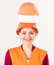 Woman on happy smiling face in builders uniform, white background.