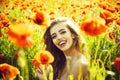 Woman or happy girl in field of poppy seed Royalty Free Stock Photo