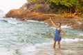 Woman happy with wave morning in Lonely Beach Royalty Free Stock Photo