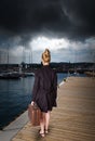 Woman at harbor - before storm Royalty Free Stock Photo
