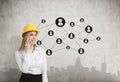 Woman in hardhat, concrete wall, network, city Royalty Free Stock Photo