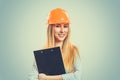 Woman in hardhat holding clipboard Royalty Free Stock Photo