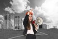 Woman in hardhat screaming in megaphone