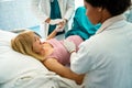 Woman hardly pushing to give child birth, natural labor and delivery