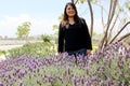 Free, happy, Latin adult woman in harmony and freedom, amid lavender flowers enjoying their beauty and aroma in a moment of relaxa Royalty Free Stock Photo