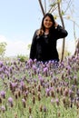 Free, happy, Latin adult woman in harmony and freedom, amid lavender flowers enjoying their beauty and aroma in a moment of relaxa Royalty Free Stock Photo