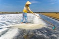 Woman harvesting salt