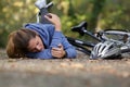 woman has fallen from bicycle and hurt elbow Royalty Free Stock Photo