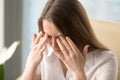 Woman has headache because of critical overwork
