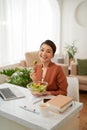 Woman has healthy business lunch in modern office interior Royalty Free Stock Photo