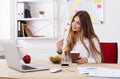 Woman has healthy business lunch in modern office interior Royalty Free Stock Photo