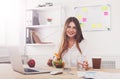 Woman has healthy business lunch in modern office interior Royalty Free Stock Photo