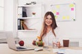 Woman has healthy business lunch in modern office interior Royalty Free Stock Photo