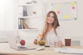 Woman has healthy business lunch in modern office interior Royalty Free Stock Photo