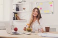 Woman has healthy business lunch in modern office interior Royalty Free Stock Photo