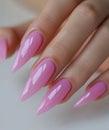 a woman has pink acrylic nails
