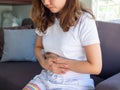 A woman has severe stomach pain. Menstrual cramps Royalty Free Stock Photo