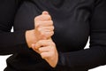 The woman has sore finger, she holds on to him with her healthy hand. Horizontal, color photo close-up