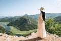 Woman in hat admires beautiful view. Royalty Free Stock Photo