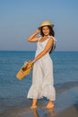 woman with hat on the beach Royalty Free Stock Photo