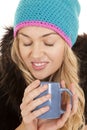 Woman hat coat mug eyes closed Royalty Free Stock Photo