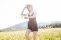 beautiful woman in a hat in a field of chamomile flowers Royalty Free Stock Photo