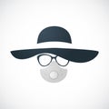 Woman in hat, glasses and respirator.