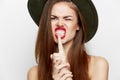 Woman in a hat Gnashing teeth passion hand gesture sexy look