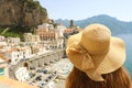 Woman with hat looking at typical italian landscape of Atrani village, Amalfi Coast, Italy Royalty Free Stock Photo