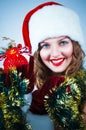 Woman in and hat of Santa with a christmas ball Royalty Free Stock Photo