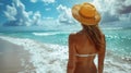 Woman in Hat Sitting on Beach Royalty Free Stock Photo