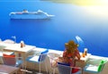 Woman in hat sitting in cafe and enjoys views of the Caldera and cruise ship, Santorini, Fira, Greece