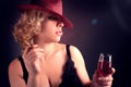 Woman in hat with wine red in glass Royalty Free Stock Photo