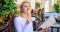 Woman have drink cafe terrace outdoors. Find opportunity to read more. Mug coffee and interesting book best combination Royalty Free Stock Photo