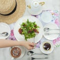 Woman have a fresh vegetable salad