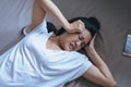 Woman have a headache severe on bed after wake up in the morning