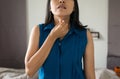 Woman have a sore throat,Female touching neck with hand Royalty Free Stock Photo