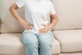 woman having abdomen ache due to Stomach pain, digestion with constipation or Diarrhea from food poisoning, female problem and Royalty Free Stock Photo