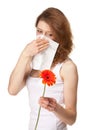 Woman having allergy from spring flowers Royalty Free Stock Photo