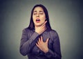 Woman having asthma attack or choking can`t breath suffering from respiration problems