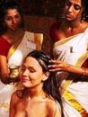 Woman having ayurveda spa treatment.