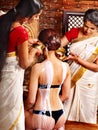 Woman having Ayurvedic spa treatment.