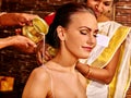 Woman having Ayurvedic spa treatment