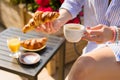 Woman having breakfast on balcony Royalty Free Stock Photo