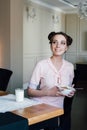 Woman having Breakfast with cereals and milk with a smile Royalty Free Stock Photo