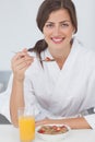 Woman having breakfast with orange juice and cereals Royalty Free Stock Photo