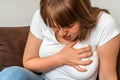 Woman having chest pain, heart attack